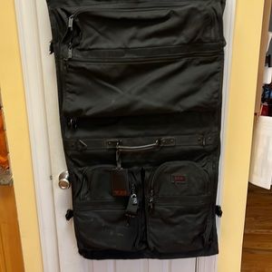 Tumi hanging travel bag. Comes with strap  and hook. In excellent condition.